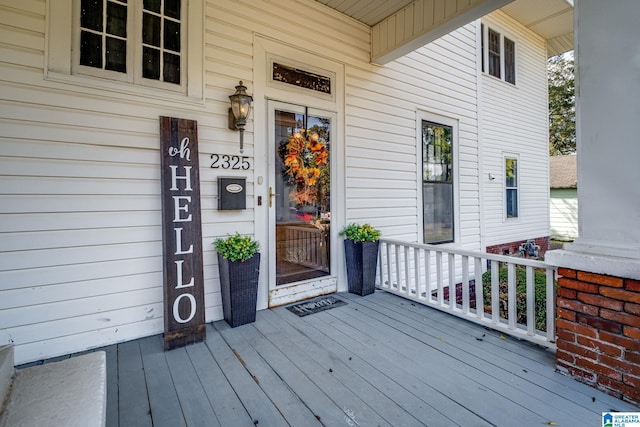 view of exterior entry featuring a porch