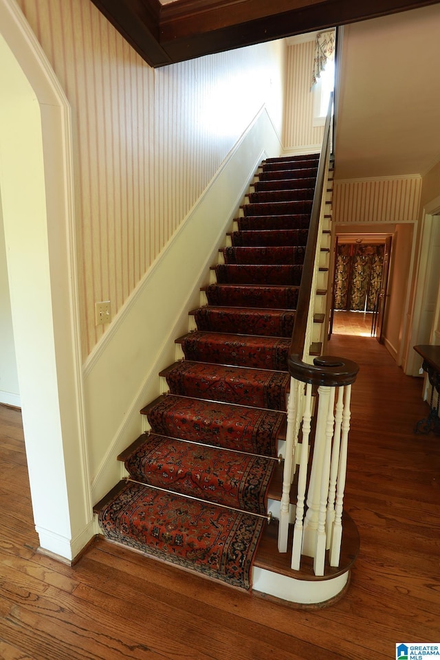 staircase featuring hardwood / wood-style floors