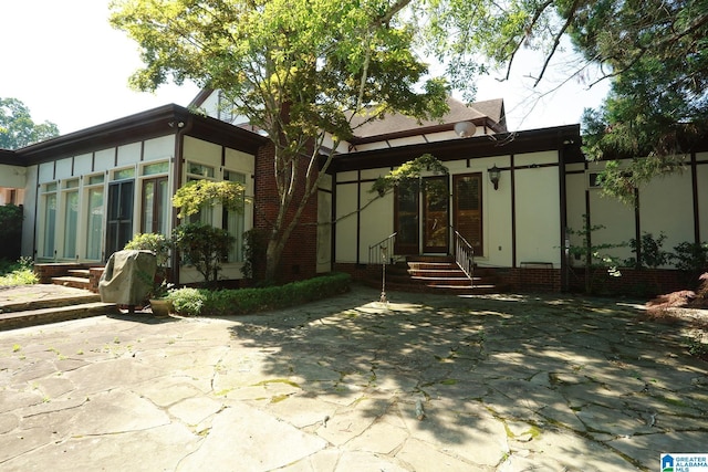 rear view of property with a patio area