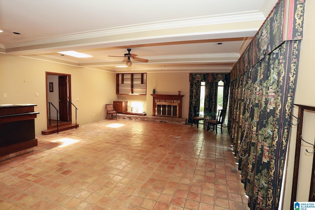 unfurnished living room with ceiling fan and crown molding