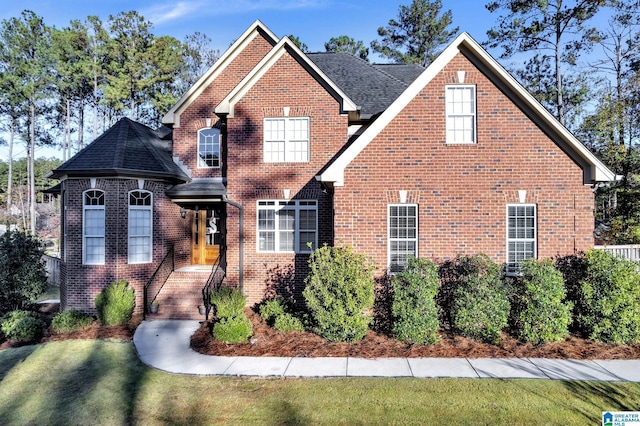 view of property featuring a front yard