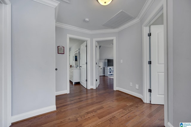 corridor featuring crown molding and dark wood-type flooring