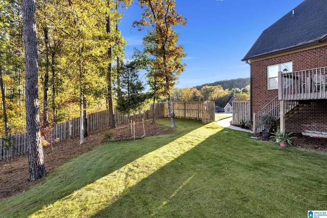 view of yard with a wooden deck