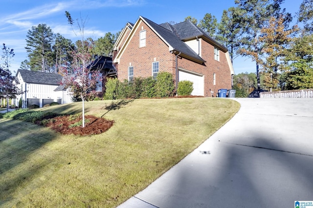 view of home's exterior with a yard and a garage