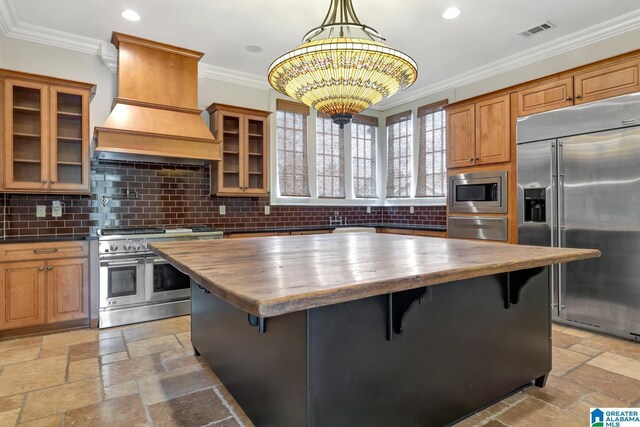 dining space featuring beam ceiling, dark wood-type flooring, and a chandelier