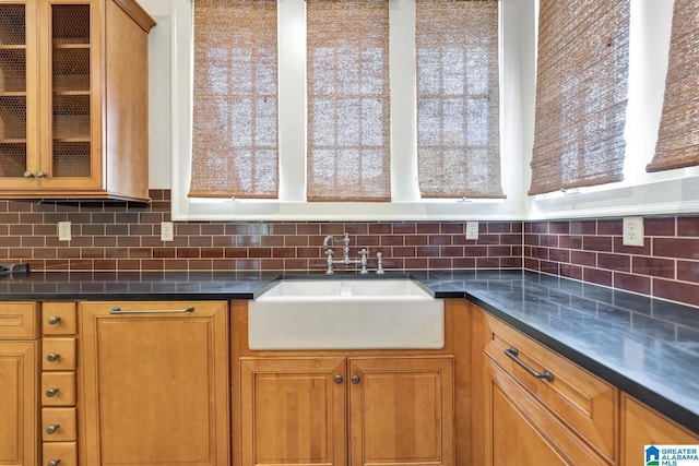 bathroom featuring a shower with door and vanity