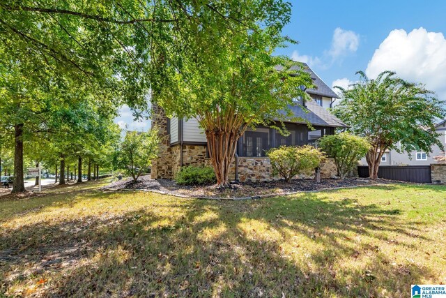 view of yard with a sunroom