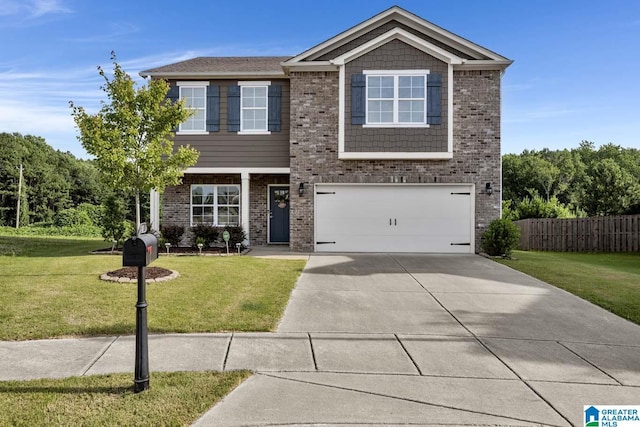 view of front of home with a front lawn and a garage