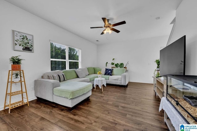 living room featuring dark hardwood / wood-style floors and ceiling fan