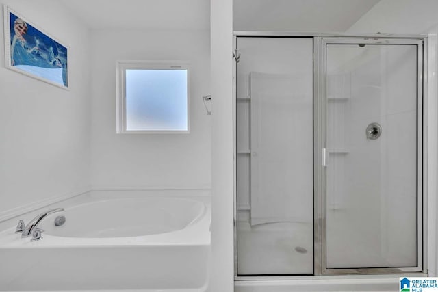 bathroom with separate shower and tub