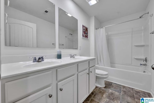 full bathroom featuring shower / bath combo, vanity, and toilet