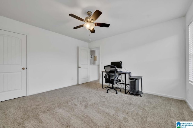 office with light carpet and ceiling fan