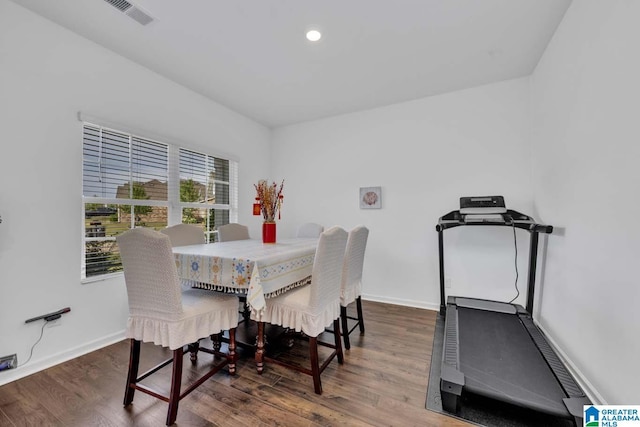 dining room with dark hardwood / wood-style flooring