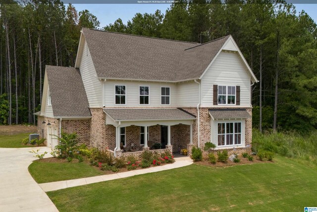 view of front of property featuring a garage and a front lawn