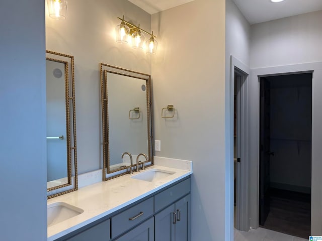 bathroom with tile patterned floors and vanity