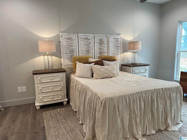 bedroom featuring dark hardwood / wood-style flooring