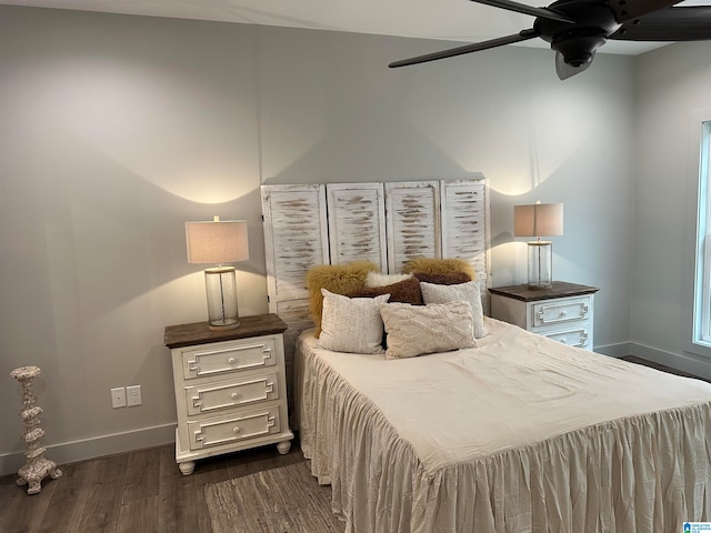 bedroom featuring ceiling fan and dark hardwood / wood-style floors