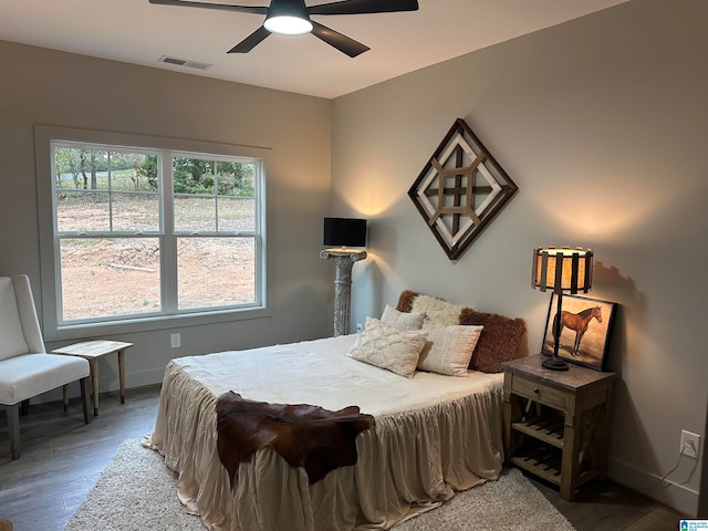 bedroom with hardwood / wood-style flooring and ceiling fan