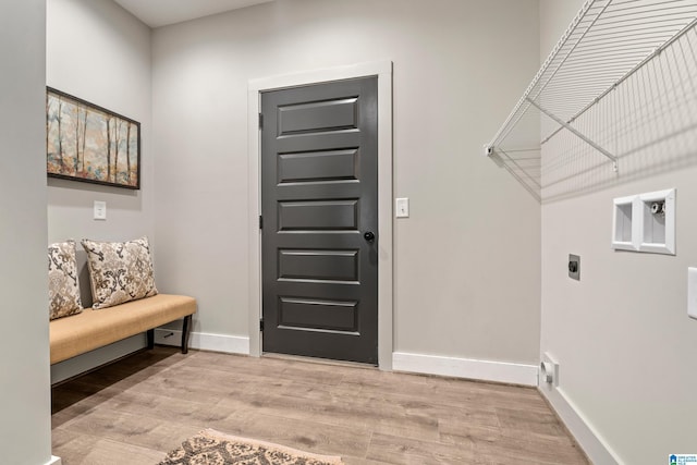 interior space with light hardwood / wood-style flooring and hookup for an electric dryer