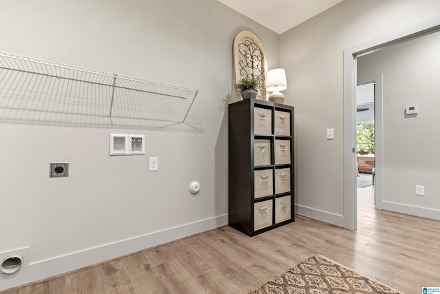 laundry room featuring washer hookup, light hardwood / wood-style flooring, hookup for an electric dryer, and gas dryer hookup