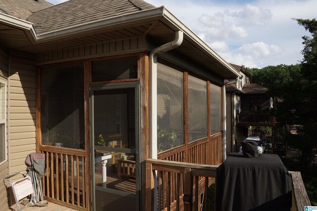 view of side of property with a sunroom