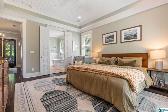 bedroom featuring ensuite bathroom, dark hardwood / wood-style flooring, and ornamental molding