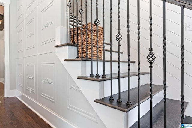 stairs featuring dark hardwood / wood-style floors