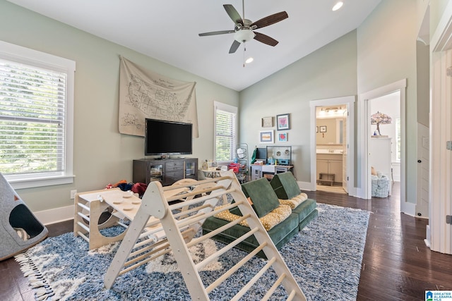 living room with high vaulted ceiling, dark wood-type flooring, and ceiling fan