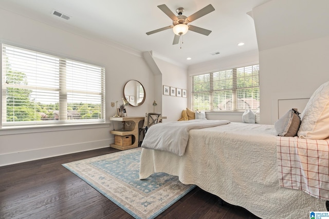 bedroom with ceiling fan, dark hardwood / wood-style floors, and crown molding