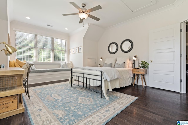 bedroom featuring ceiling fan, dark hardwood / wood-style flooring, vaulted ceiling, and ornamental molding