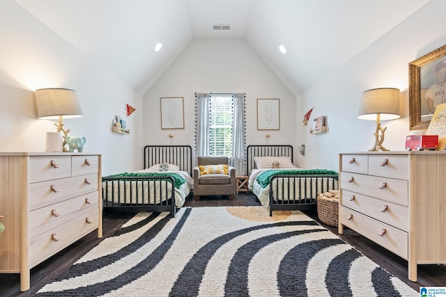 bedroom with lofted ceiling and dark wood-type flooring