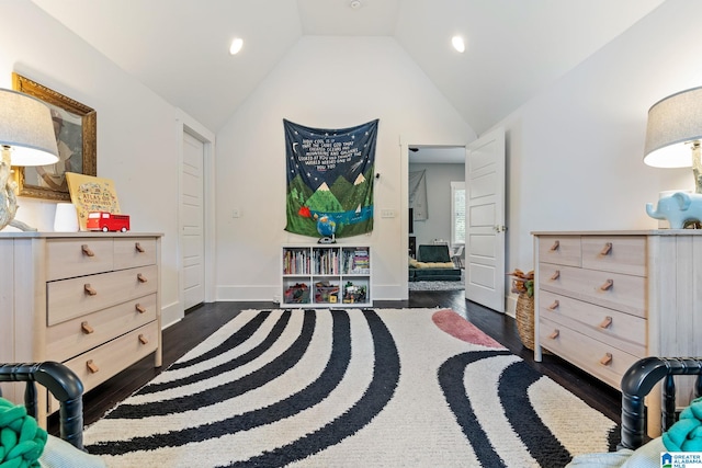 bedroom with dark hardwood / wood-style floors and lofted ceiling