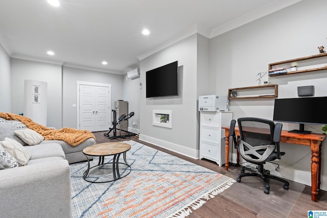 office space featuring a wall unit AC, hardwood / wood-style flooring, and crown molding