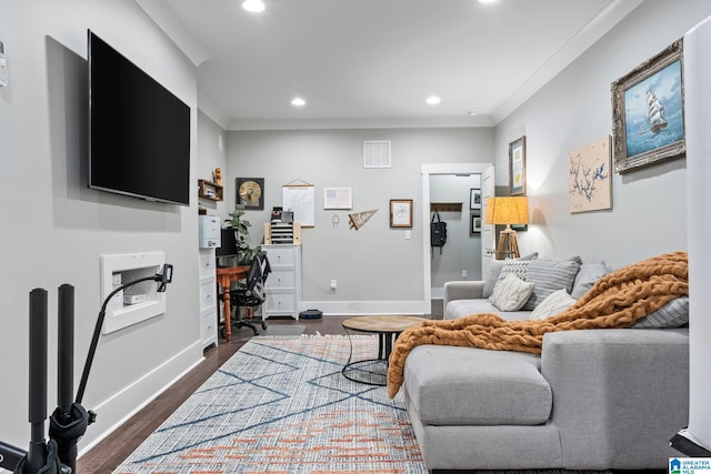 living room with dark hardwood / wood-style flooring and crown molding