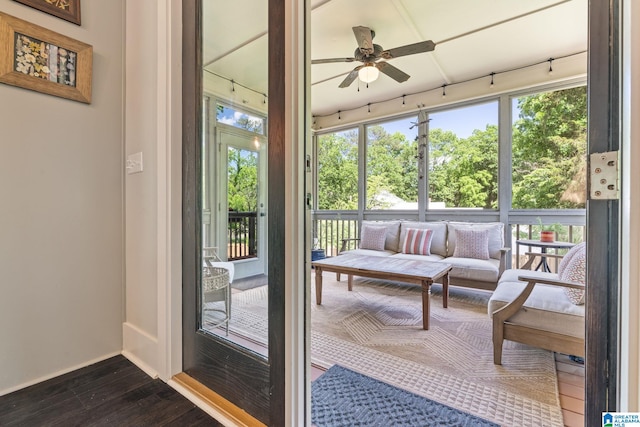 sunroom featuring ceiling fan