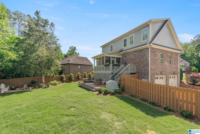 rear view of property with a sunroom and a lawn