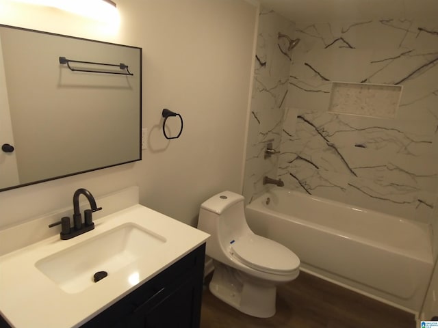 bathroom with toilet, vanity, shower / tub combination, and wood finished floors