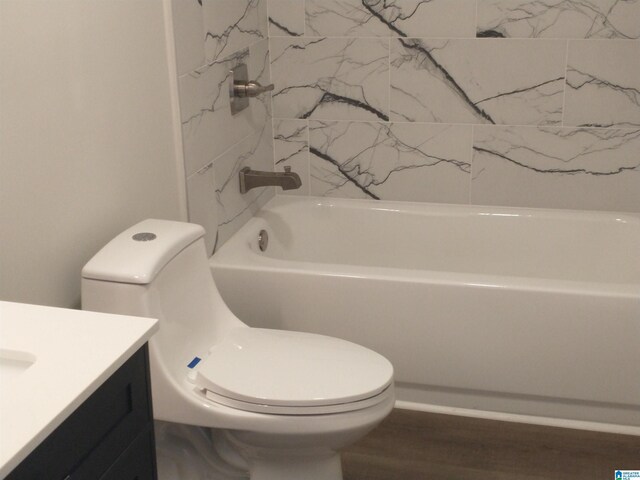 bathroom featuring hardwood / wood-style flooring, vanity, and toilet