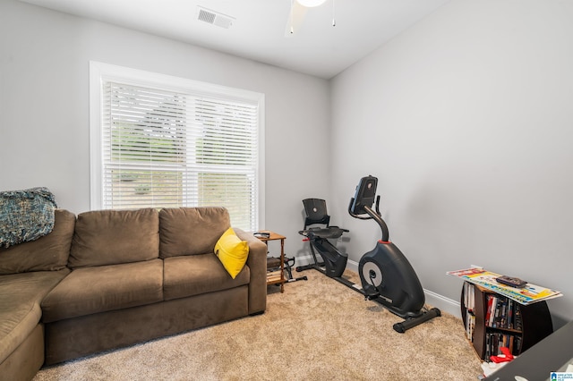 exercise area with carpet floors and ceiling fan