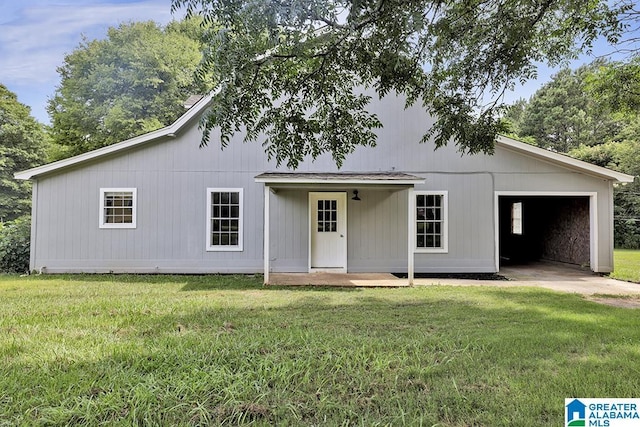 view of front of home with a porch, a garage, and a front yard