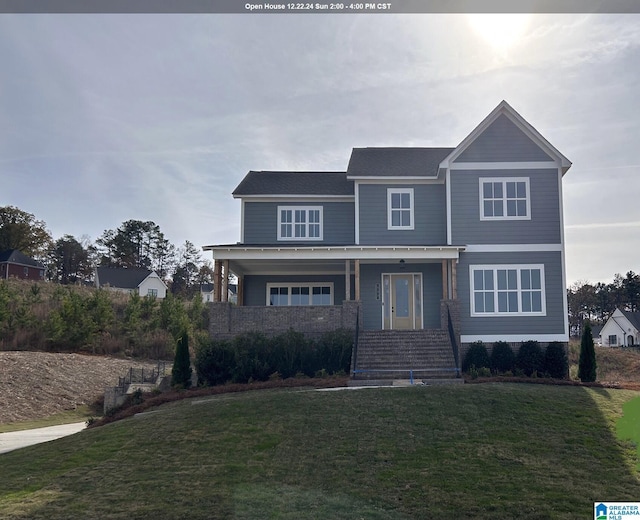 view of front facade with a porch and a front lawn