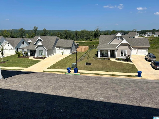 view of front of house with a garage and a front yard