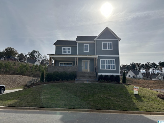 view of front of house with a front lawn and a porch