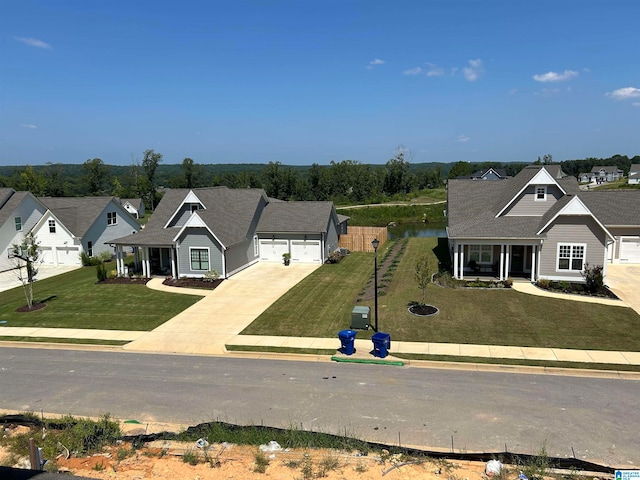 view of front of property featuring a front lawn and a garage