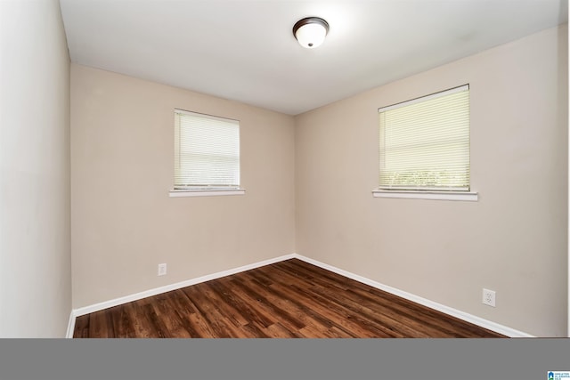 empty room with hardwood / wood-style floors