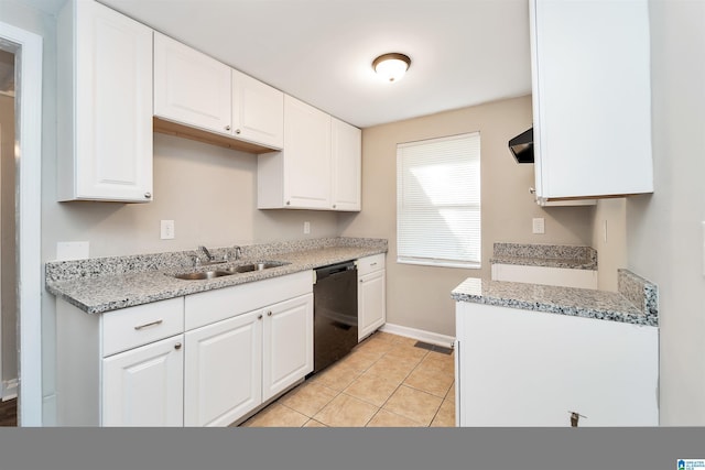 kitchen with light stone countertops, sink, light tile patterned floors, black dishwasher, and white cabinetry