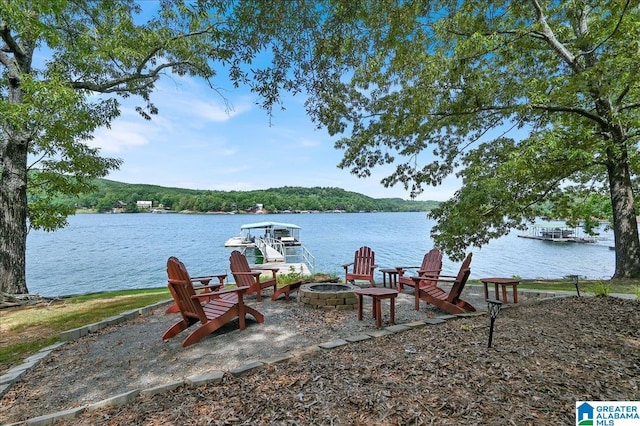 dock area featuring a water view and a fire pit