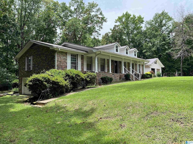 view of front of house featuring covered porch and a front yard