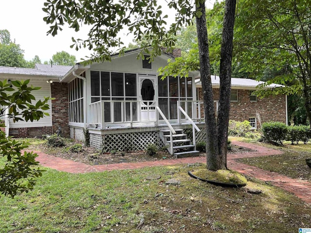 view of front facade featuring a sunroom