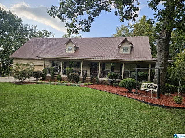 view of front of house with covered porch and a front lawn